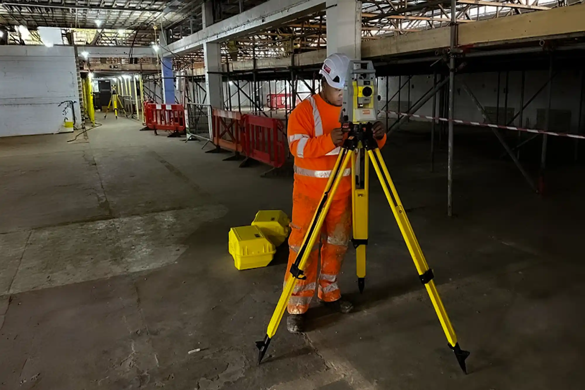 An engineer conducting a survey tripod